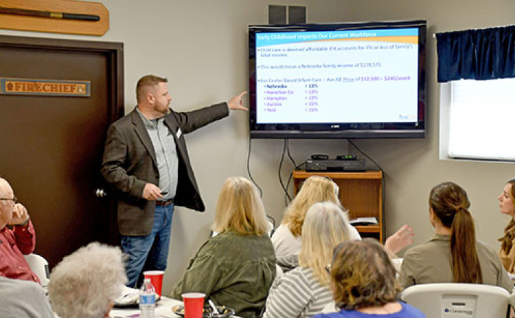 Mike Feeken of First Five Nebraska shows a slide to point out that Nebraska families spend on average 13 percent of their income on child care. He said 7 percent of household income is considered affordable when it comes to daycare. Feeken’s presentation was part of two public meetings held in Hampton last Wednesday to discuss the impact of affordable and dependable child care on a community.