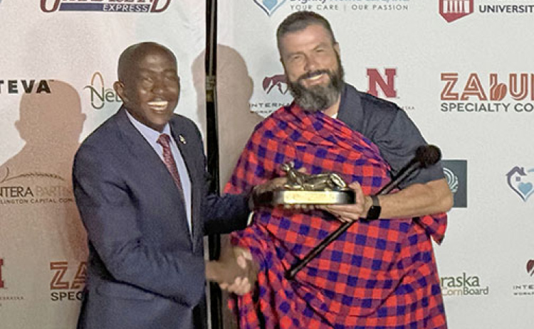 On his trade mission trip to Kenya in February, Giltner farmer Brandon Hunnicutt (right) receives gifts from Dr Gideon Maina, Vice Chancellor of Pioneer International University. The school was founded by the man who was the first Pioneer Seed dealer in Kenya and is known as the “Warren Buffett of Kenya.”
