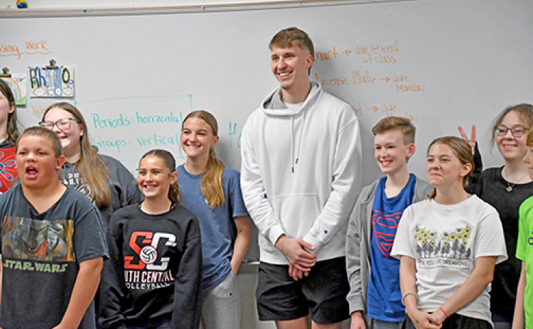 Former Husky and NBA hopeful Baylor Scheierman posed with several middle school classes after sharing his motivational message Friday afternoon.