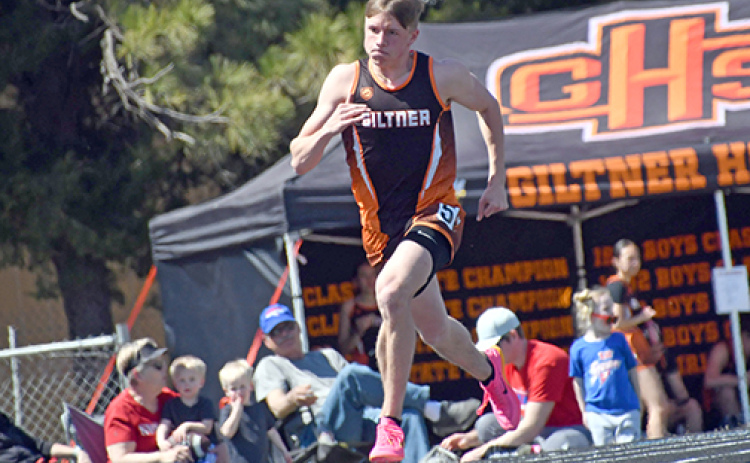 Phillip Kreutz, shown here in an event earlier this season, won both the 400 and 800 races at Staurday’s Twin Valley Conference meet as the boys won the team title for the first time.