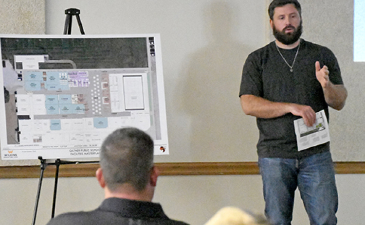 Giltner school board member Nathan Most describes the location of new locker rooms in the high school gym at Monday night’s school board meeting.