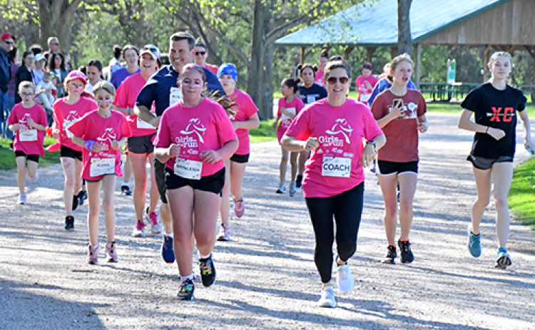 Approximately 30 girls from Aurora and Hampton and their run buddies ran a 5K through Streeter Park Monday evening, the last leg of an international nonprofit program designed to help build self-esteem.