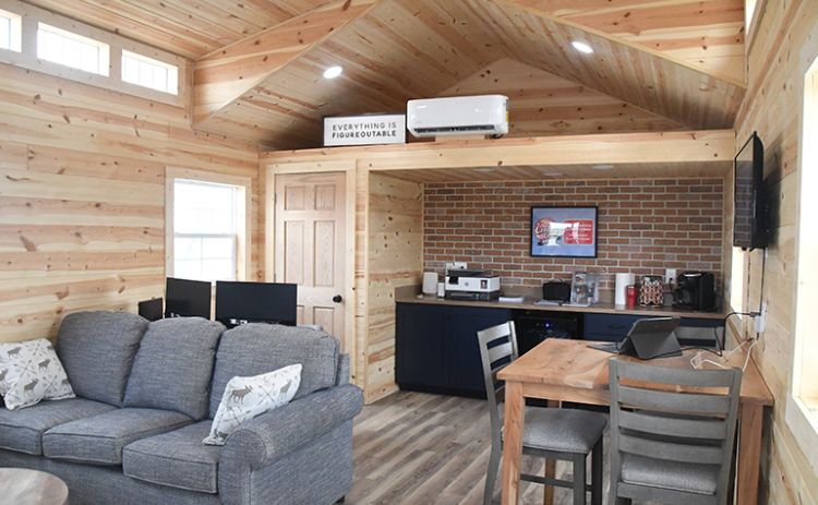 Co-owners Brian and Grant Litz have rebranded a portable building business to NE Sheds with their new partnership with Mid-America Structures. Shown here is the interior of one of the units, which serves as their office space.