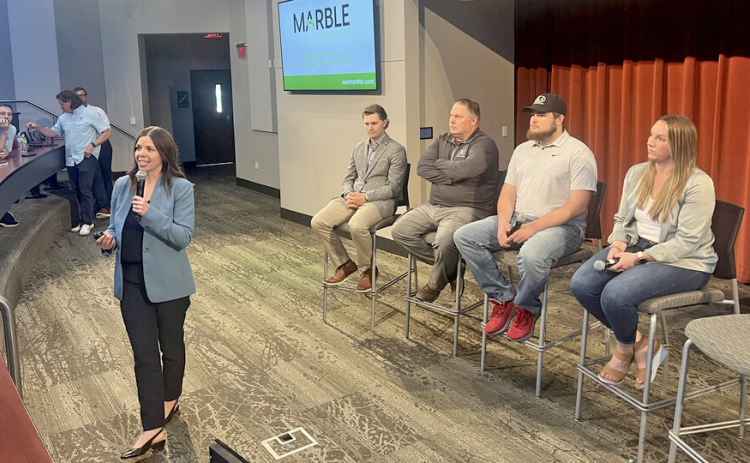 Jordyn Bader discusses her work with the ag-tech startup Marble Technologies during the Heuermann Lecture on May 29. She was part of a panel of ag-tech entrepreneurs that also included (from left) Shane Forney of Sentinel Fertigation; Chad Johnson of Grain Weevil; Jacob Hansen of ALA Engineering; and Jessica Korinek of Nave Analytics. (Cara Pesek/IANR Media)