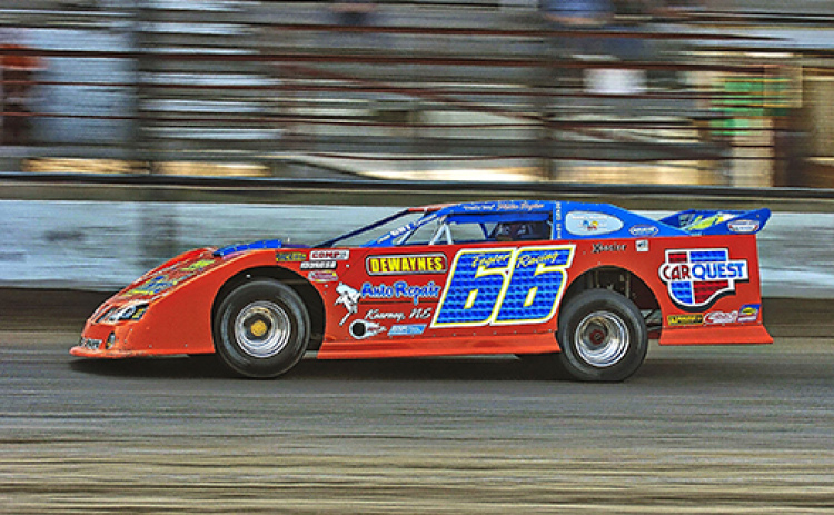 Jerry Jacobs stops a moment in time, photographing a late model car racing at Mid-Nebraska Speedway in Doniphan.