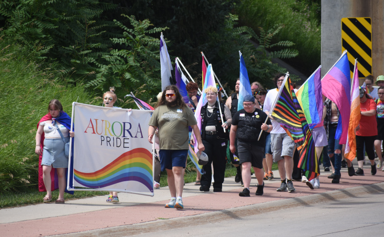 Aurora’s Pride crowd makes its way under the underpass near Refshauge Park during Saturday’s annual march.