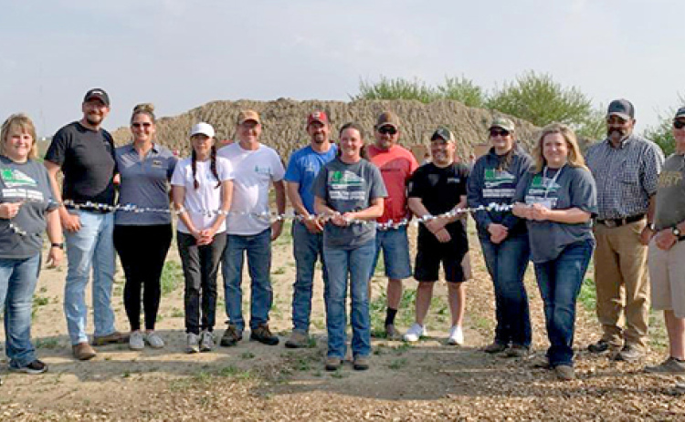 Volunteers involved with the construction of a new 4-H shooting range for Hamilton County prepare to cut the ribbon on the facility on May 13. From left are Carrie Siebke, Justin and Christina Dose, Jeannie and John Wilkinson, Sean and Christi Aycock, Brian Majerus, Justin Hermanson, Misty Mooney, Tanya McKay, Jeremy Brandt and Keith Wasem. 4-H shooting instructors not pictured are Dana Glass and Taylor Comer.