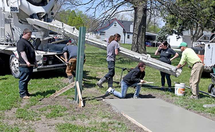 A new concrete tee pad is poured for the Refshauge Park Disc Golf course in Aurora