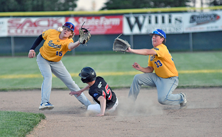 Charlie Evans splits between and underneath the Kearney Jersey’s middle infield on a stolen base in the Aurora Pinnacle Bank Seniors’ 17-2 win last week.