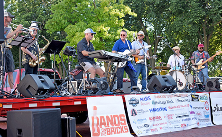 Mike Semrad and the Nighthawks deliver tunes to Aurora’s downtown square. This is the band’s fourth time playing at Bands on the Bricks.