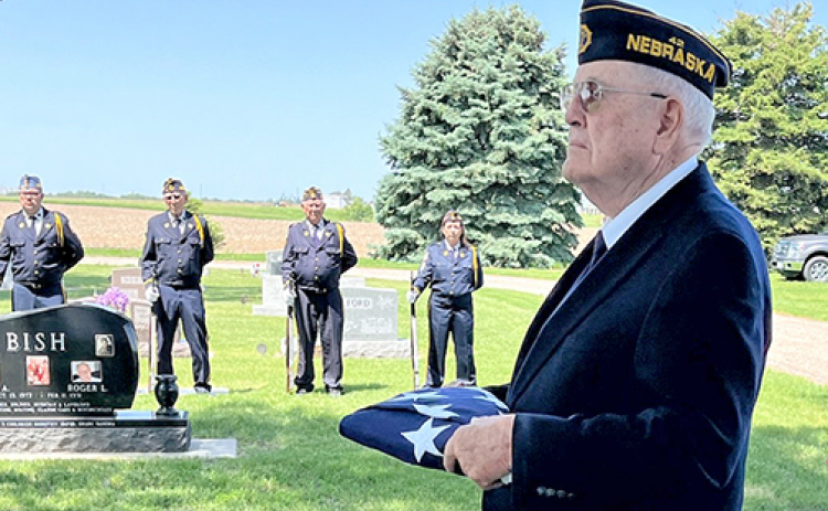 As a member of the American Legion color guard, Robert ‘Bob’ Leach, folded and presented dozens of American flags to family members of deceased veterans. In May he joined the color guard again to present a flag to the family of fellow veteran and long-time friend Richard ‘Dick’ Grosshans.