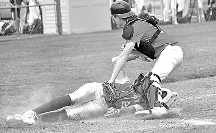 Aurora’s Dylan Ronnau slaps the tag on a Cozad baserunner for the game’s final out, sealing a 7-4 win Friday to open the B6 area tournament.