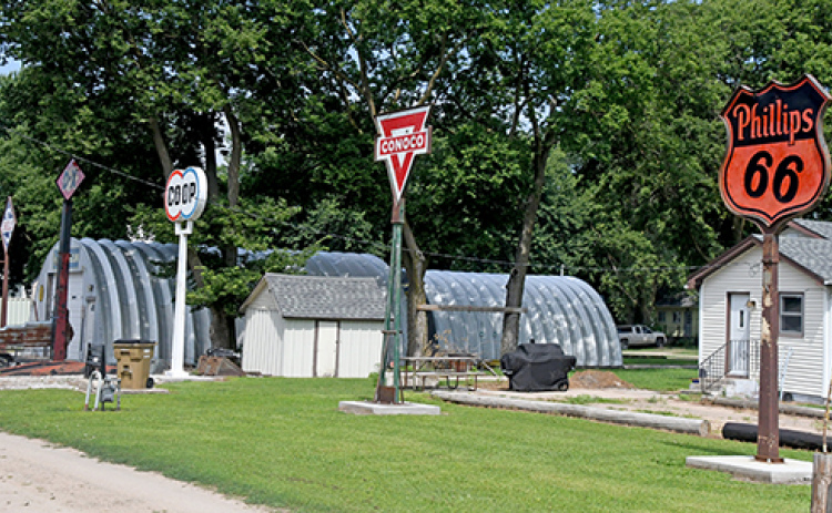 Some of Randy Beckman's oil company signs on his property in Marquette.