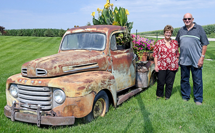 Turning his truck into a happy little accident, Dean Jost has decorated the flatbed of his truck with flowers which can be found on display on East 8th Rd along Hwy 14 south of Aurora. Standing next to the truck are Loretta and Dean Jost.