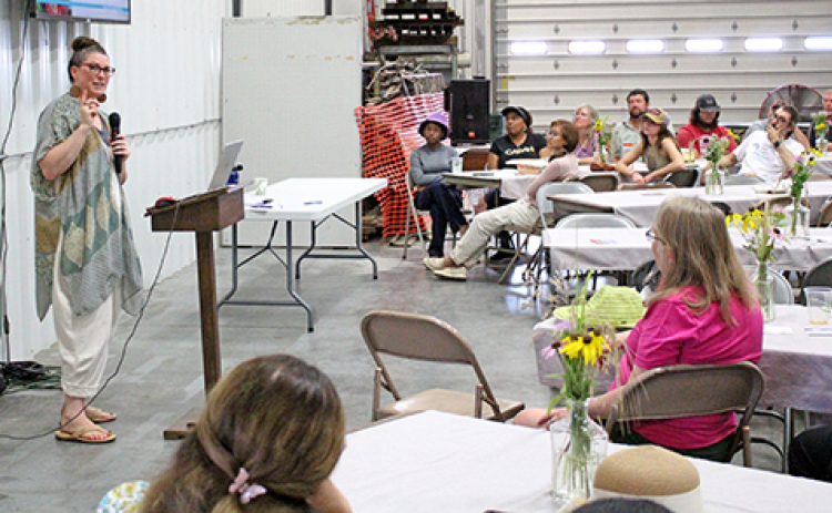 Amber Sciligo, director of science programs for the Organic Center headquartered in Washington, D.C. speaks to attendees at Grain Place Foundation’s annual Field Day near Marquette on July 13.