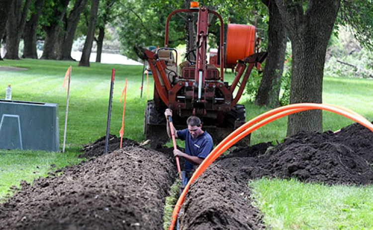 This ANR archive photo shows Hamilton crews burying a fiber cable near Poco Creek Golf Course as part of the company’s fiber-to-the-home initiative.