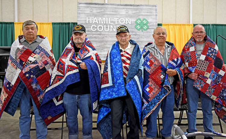 Five Hamilton County veterans are honored with Quilts of Valor. These quilts were presented by the Nimble Thimble Quilt Guild of Aurora and the Hamilton Community Foundation. Pictured from left are: Ron Akerson, Charles Dudding, Denton Goertzen, Terry Ott and Paul Van Housen.