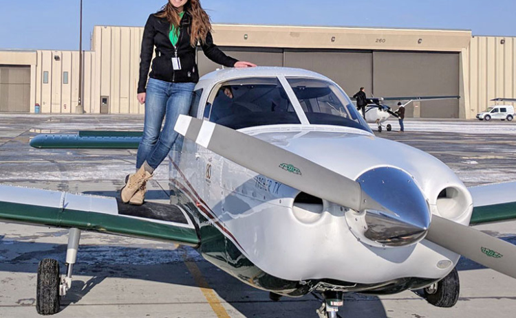 Bethany (Janzen) McFadden has been flying out as a commerical pilot in Kearney since 2021. McFadden poses next to a plane after she completed her first solo flight in 2017.