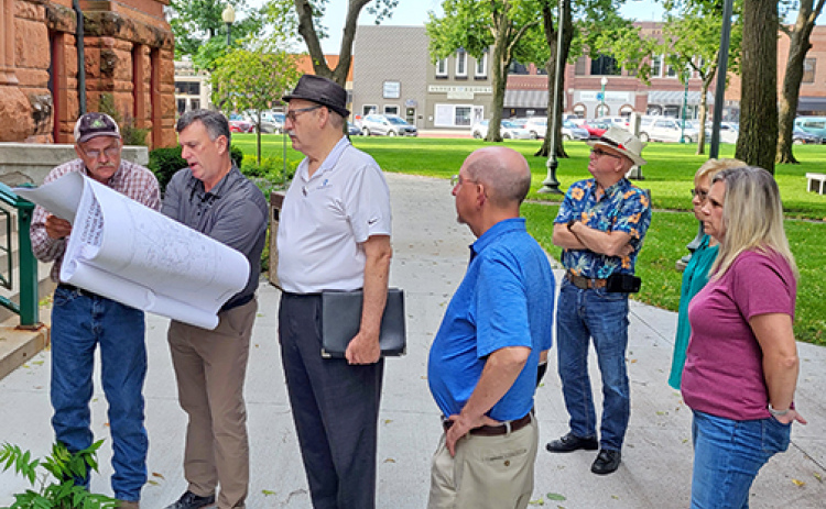 The Hamilton County Commission took its meeting outdoors for a time Monday morning so that board members could see first-hand what was being proposed in the first phase of a courthouse renovation and preservation project. From left are Commissioner Francis McDonald, civil engineer Chris Lane, preservation architect Jerry Berggren, Commissioner John Thomas, County Attorney Douglas Dexter and Commissioners Nancy Salmon and Nicole SaBell.
