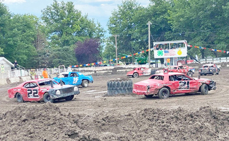 This photo of an NeFigure8n race held at Wahoo earlier this summer shows the fast-paced action and potential for collisions that have made the sport popular with drivers and spectators alike over the past several years across Eastern Nebraska.
