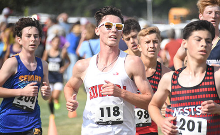 Evan Hermanson battles through a gaggle of runners at Thursday’s Seward Invite, finishing 23rd.