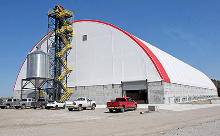 The new hoop building grain receiving facility at Murphy constructed this summer by Aurora Coop has a capacity of two million bushes and will be used to store soybeans from the fall harvest this year. Below, the pit and leg can unload trucks at a rate of 30,000 bushels per hour.
