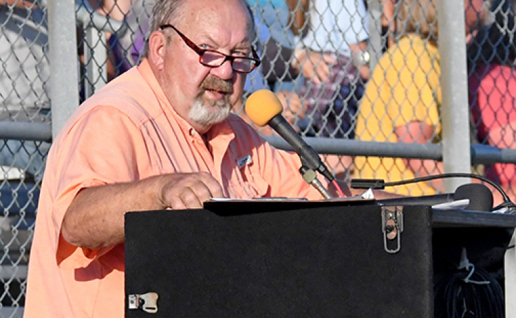 Announcing at his last public event before retirement, the Voice of Hamilton County, Deryl Hilligas, speaks to the crowd at the NeFigure8n finals in August at the Hamilton County Fairgrounds.