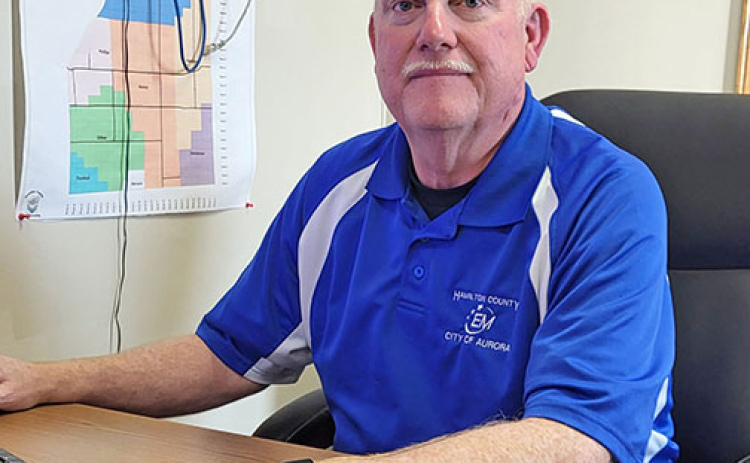 Outgoing Hamilton County Emergency Management Director Kirt Smith works at his desk at the Aurora Fire Station.
