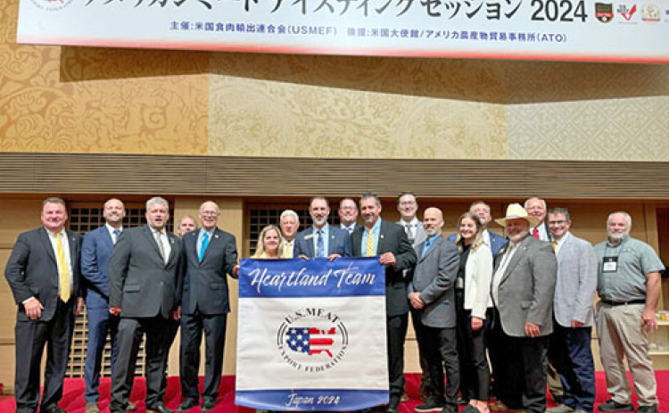 Hamilton County Corn Growers President Mike Bergen (center, behind banner) stands in Tokyo, Japan with the other members of the Heartland Team from USMEF that made a trade mission to the Asian nation in early September.