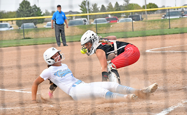 GICC’s game-winning run over Aurora was this close at the plate as the throw down to Londyn Teahon was just a bit late. The Crusaders escaped with a 9-8 win over the Huskies Monday in the opening round of the B-8 subdistrict tournament in York.