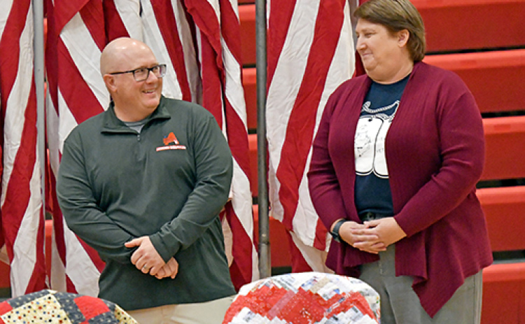Aurora teachers Tim Elge (left) and Brenda Klawonn were both honored by the Aurora American Legion Post 42 Monday during a Veteran’s Day program for their efforts in the Heroes and Huskies project.