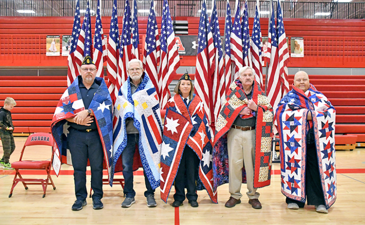 Five Aurora veterans received Quilt of Valor honors during Monday’s program at the school. Those include from left: Aaron Nilson, Roger Levering, Dana Kort, Gale Christenson and Priscilla Balasa.