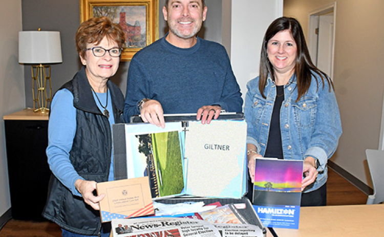 Members of the Hamilton Community Foundation board shown with a time capsule commemorating the organization’s 60th anniversary include, from left: Mary Mickey, Jeff Morris and April Mason.