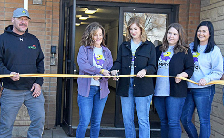 Hampton Supt. Holly Herzberg and Hampton Day Care Foundation board president Tamara Wiens cut the ribbon to officially open the new Hawk Learning Center, home of Hampton’s new community daycare center on Saturday. At left is Hampton School Board president Grant Dose and at right are Stephanie Buller and Hearts for Kids auction co-coordinator Haley Bamesberger.
