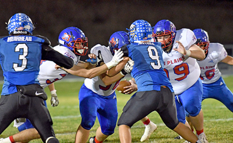 High Plains and Overton played physical Friday night with plenty of crashing hits and big plays. Above, HPC’s front line of Carter Urkoski (33), Caleb Sharman (90) and Kaden Rieken (90) setting up the run block.