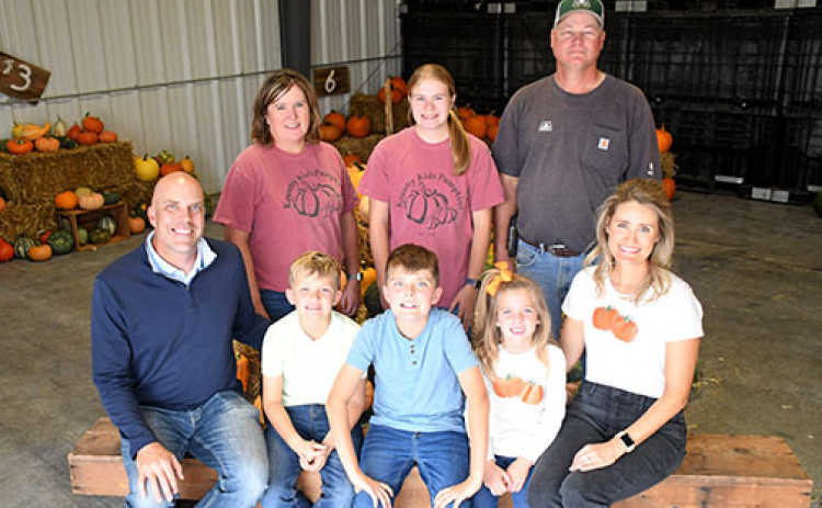 Pictured in the front row are the new owners of Kountry Kids Pumpkins, including Eric, Evan, Will, Allie and Megan Dam. Back from left are former owners Barb, Morgan and Greg Bonifas. Not pictured are Grant and Blaine Bonifas.