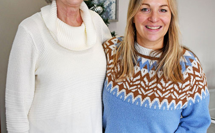 Belgian Marie Brasseur, right, a foreign exchange student to Aurora in 1997-98, stands next to Deanna Powell who was one of her four host mothers during her year in the U.S.
