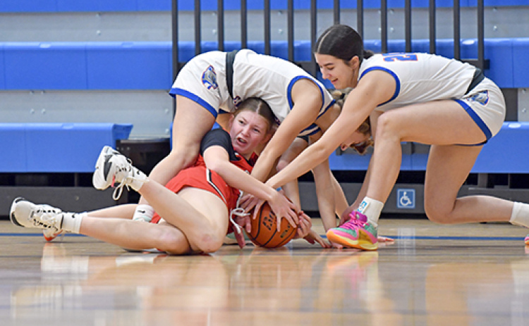 Aurora’s Kenna Merrihew went diving for a loose basketball during a 48-45 loss to Omaha Gross Friday in the Ashland-Greenwood holiday tournament. Merrihew had eight points and 16 rebounds, eight of those on the offensive glass.