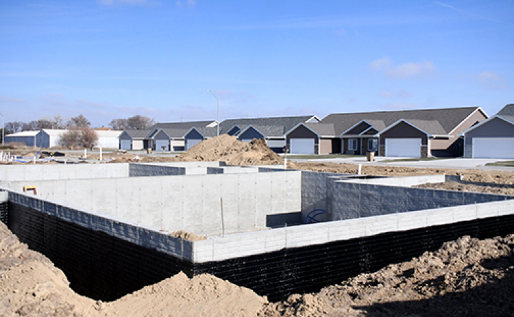 Construction has begun on two new duplexes on Cottage Park Drive, which mirror the Mesner Development project shown in the background.