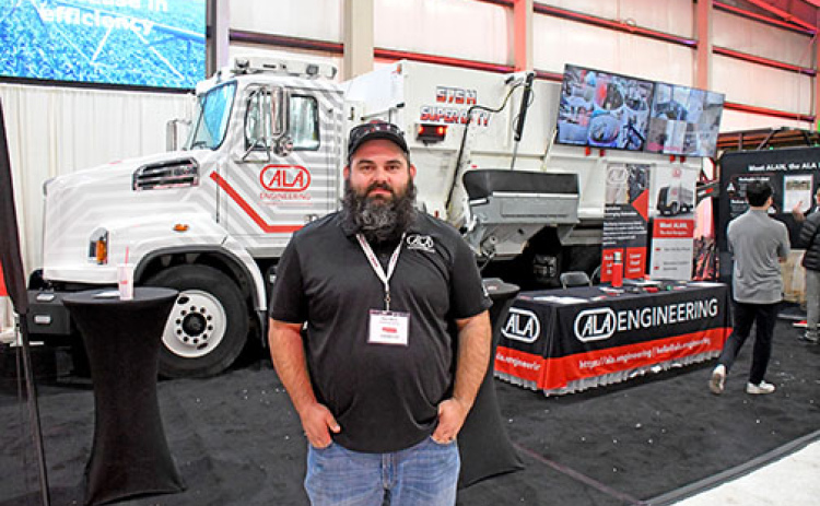 Kyle Moss, director of integration and testing for Lincoln-based ALA Engineering, stands in front of the company’s prototype autonomous cattle feeding truck on display at the Nebraska Ag Expo in early December. Moss works out of the Scottsbluff location of the company where he oversees product integration and testing.