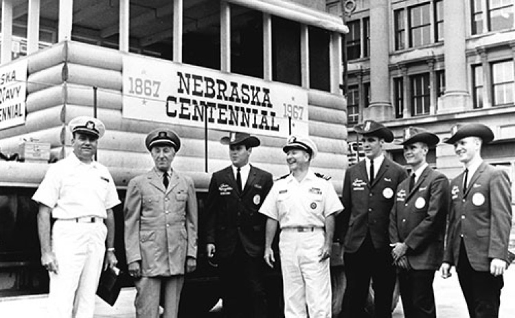 The above photo was taken during an inspection ceremy in front of the Omaha courthouse. Featured in the photo from left,  are Coast Guard Captain Hank Braun, Coast Guard Captain Harry Smith, Rich Gallentine, U.S. Navy Commander Dan Lassiter, Mark Hansen, Glenn Friendt and Tom Moderow.