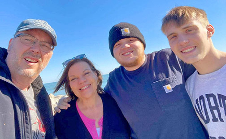 Cheryl (Jorgensen) Trimm works as a board certified behavior analyst for the Nebraska Department of Health and Human Services, assisting people who are in need of disability services. Pictured with her are her husband, Keith, are sons Devin and Landon.