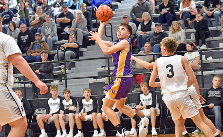 Landen Rojewski, shown here making a floater against Lawrence-Nelson Thursday, made a game-winning three-pointer against Meridian the following night. In all, the Hawk freshman scored 28 points between the two games.