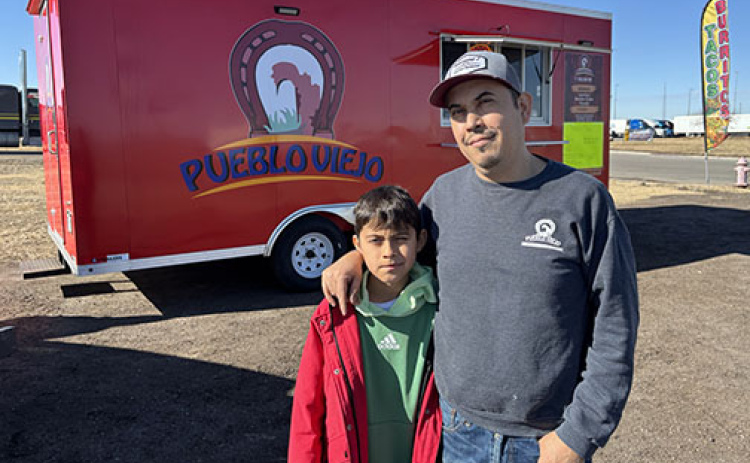 Antonio Sanchez and his son, Anthon, stand by the new Pueblo Viejo food truck at a site near the I-80/Highway 14 intersection.