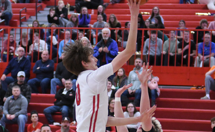 Aurora freshman Jaxson Slagle goes up strong for two of his team-high 16 points in Thursday’s dramatic 49-48 win over Omaha Skutt. Slagle hit the game-winning shot as time expired.