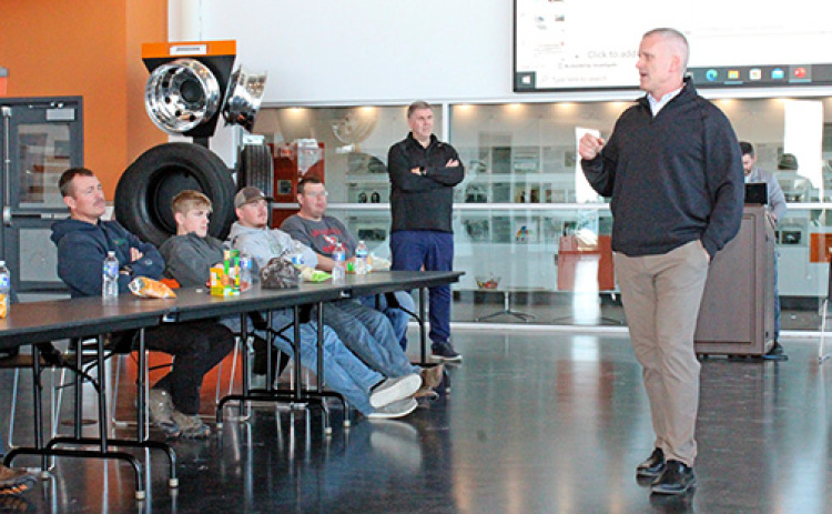 Timpte Trailers President and CEO Tim Carpenter, right, talks to members of the Hamilton County Corn Growers who attended a factory tour Thursday at the company’s David City plant where dry bulk semitrailers are built.