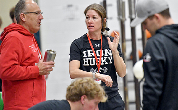 Sara Sutherland (center) is Aurora’s new strength and conditioning coach and has taken over the block zero weights class as well as the summer lifting program.