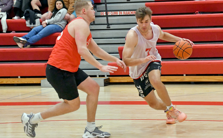 The Class of 2022/23’s Preston Ramaekers dribbles past 2018’s Ian Boerkircher during the 2024 Aurora alumni tournament final.