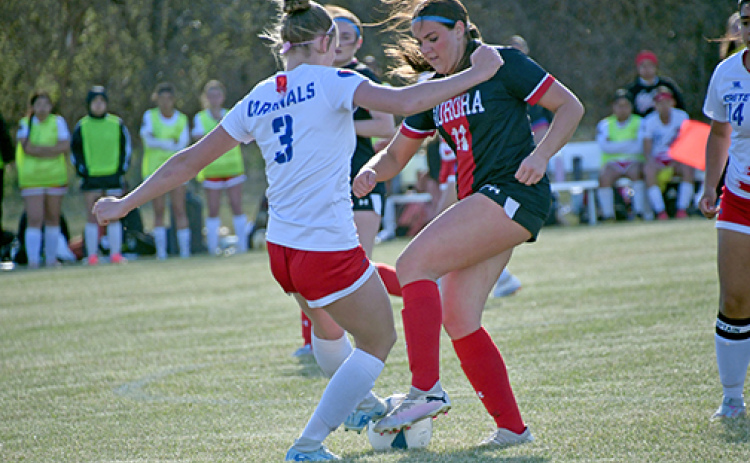 Adrianna Brei, shown here battling for possession with Crete, scored one of Aurora’s two goals in a 2-1 win at Nebraska City Friday.