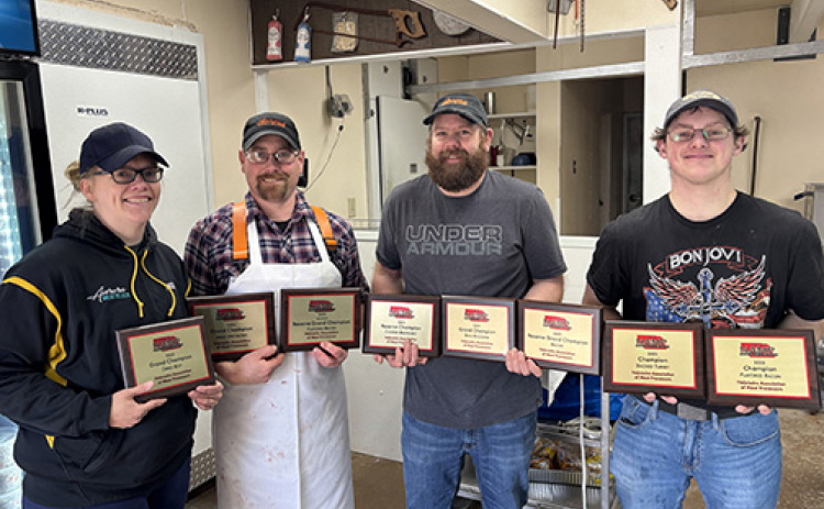 The Aurora Meat Block brought home eight honors from the Nebraska Association of Meat Processors convention in Kearney. Pictured from left are co-owners Andrea and Brent Winfield,  Josh Dick and Ed Van Landingham.